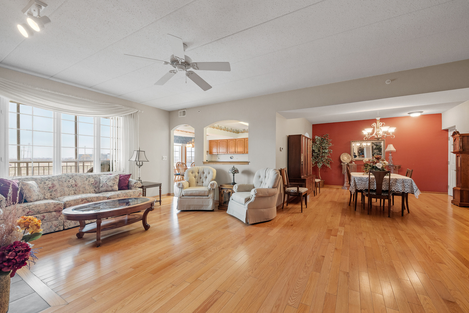 7912 Trinity Circle, Unit 1NW Tinley Park, IL 60487 - Photo 3 of 20 a living room with furniture and wooden floor