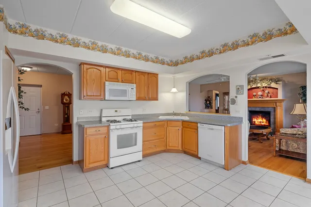 a kitchen with sink and cabinets