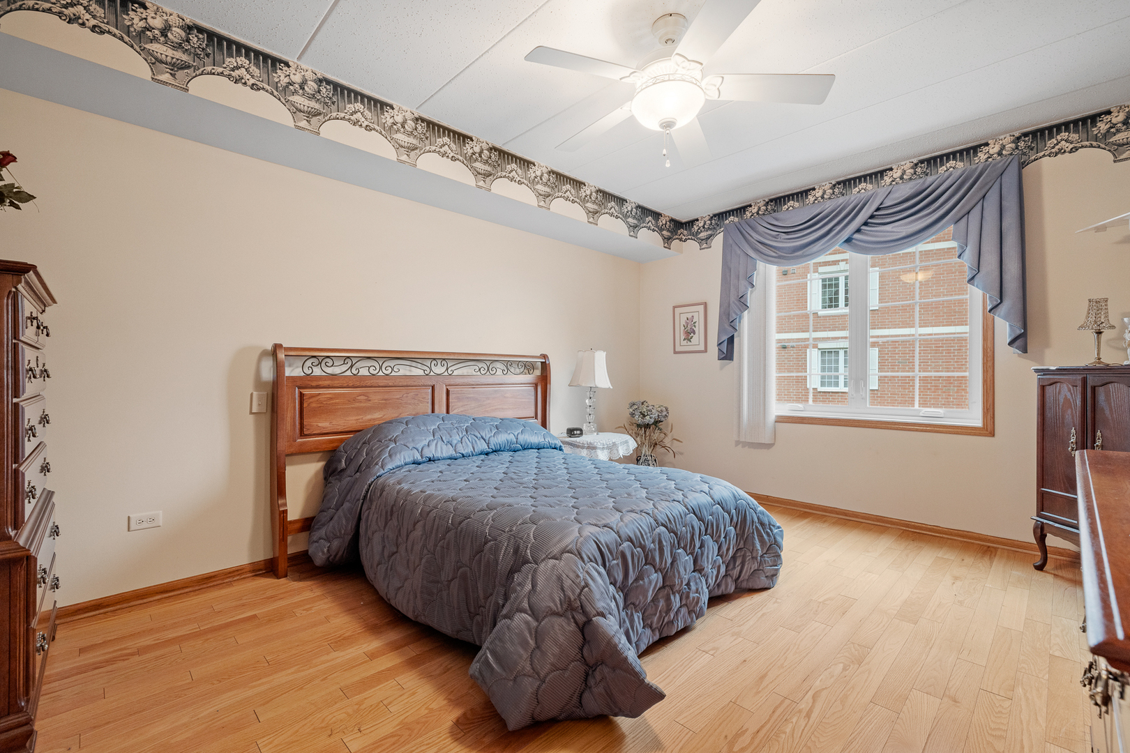 7912 Trinity Circle, Unit 1NW Tinley Park, IL 60487 - Photo 10 of 20 a bedroom with a bed mirror and window