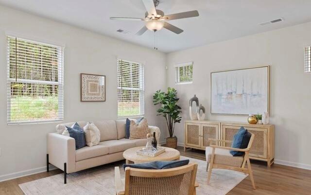 1290 Harmony Rdg Court Jonesboro, GA 30238 - Photo 11 of 29 a living room with furniture and a large window