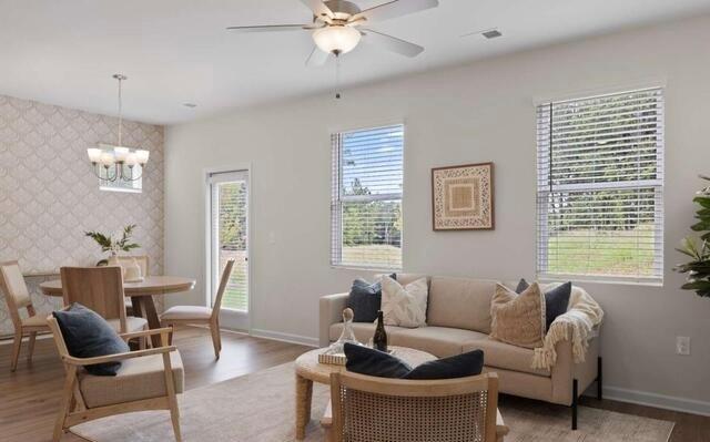 1290 Harmony Rdg Court Jonesboro, GA 30238 - Photo 12 of 29 a living room with furniture and a large window