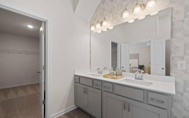 1290 Harmony Rdg Court Jonesboro, GA 30238 - Photo 22 of 29 a bathroom with a double vanity sink and a mirror