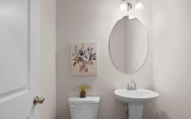 1290 Harmony Rdg Court Jonesboro, GA 30238 - Photo 29 of 29 a bathroom with a sink and a mirror