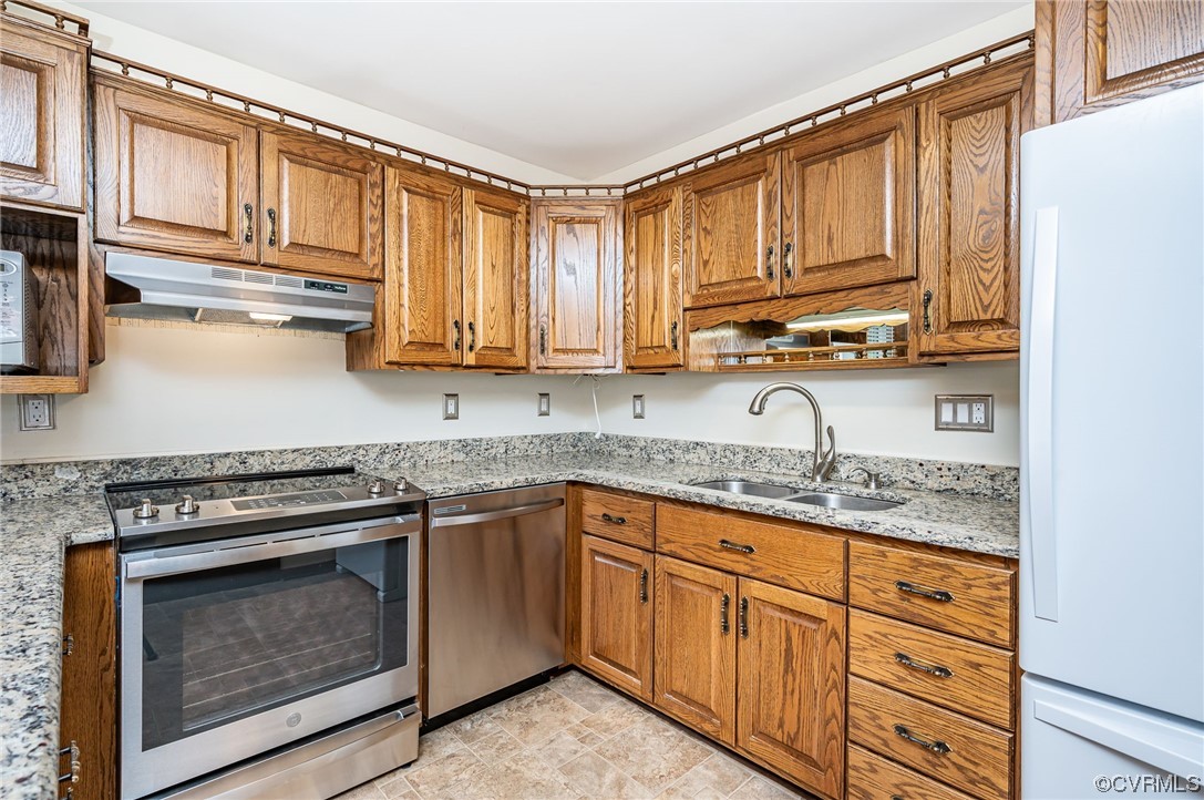 3741 Harrow Drive Chester, VA 23831 - Photo 12 of 37 a kitchen with stainless steel appliances granite countertop a stove sink and cabinets