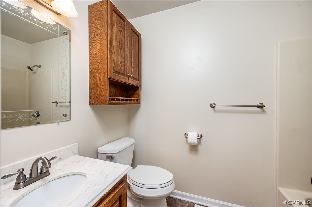 3741 Harrow Drive Chester, VA 23831 - Photo 16 of 37 a bathroom with a sink a toilet and mirror