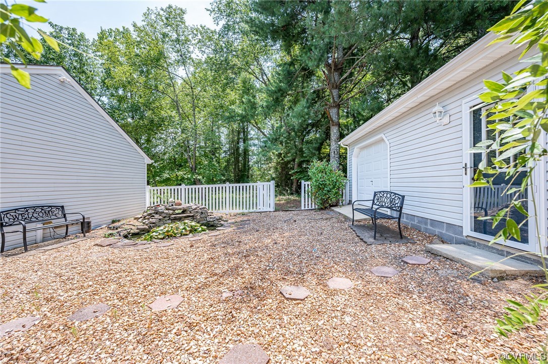 3741 Harrow Drive Chester, VA 23831 - Photo 32 of 37 a backyard of a house with table and chairs