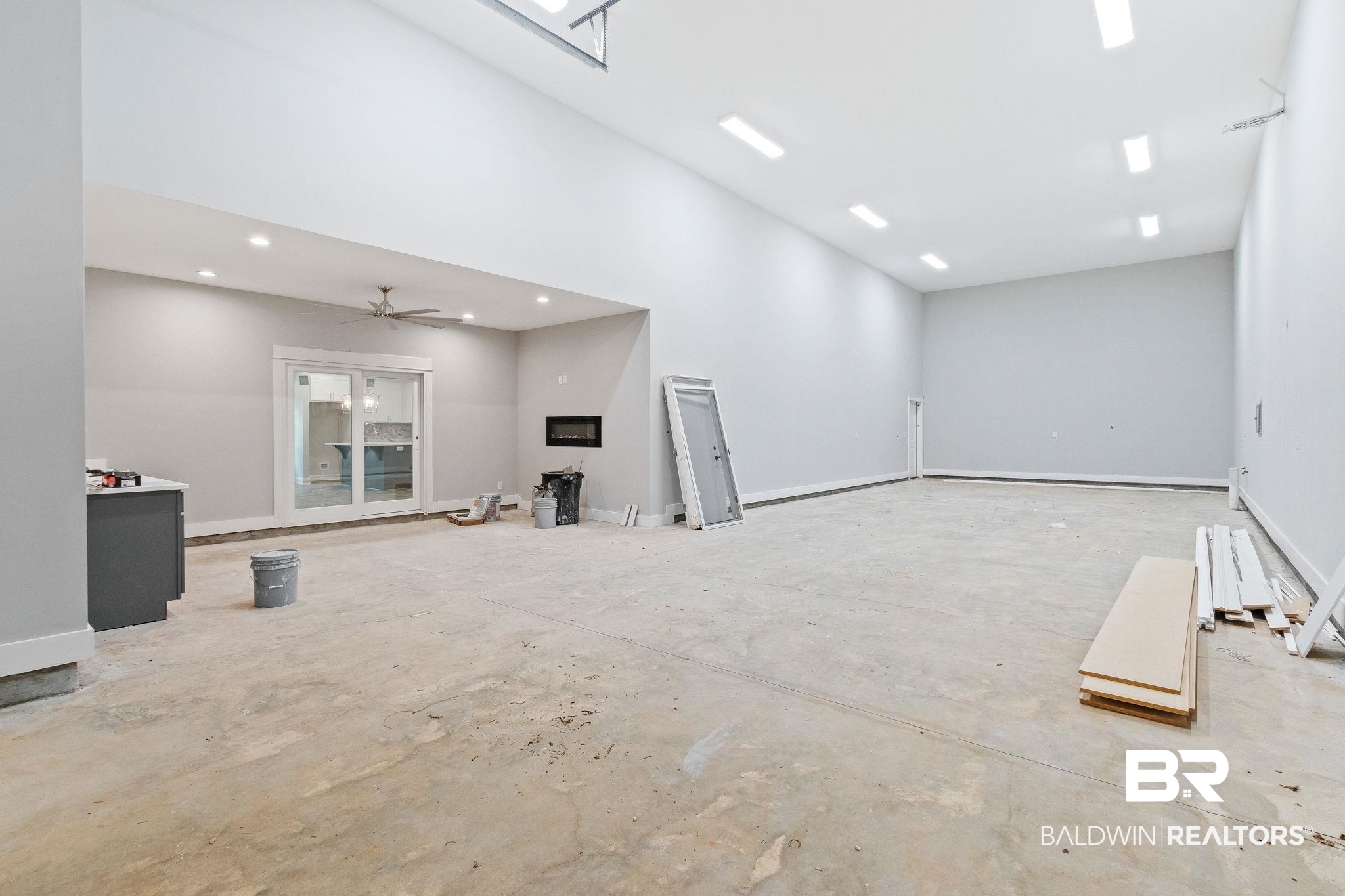 12441 Reunion Place Foley, AL 36535 - Photo 21 of 31 Unfurnished living room with ceiling fan and concrete flooring