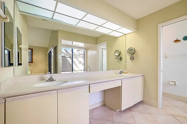 a bathroom with a sink a mirror and a bathtub