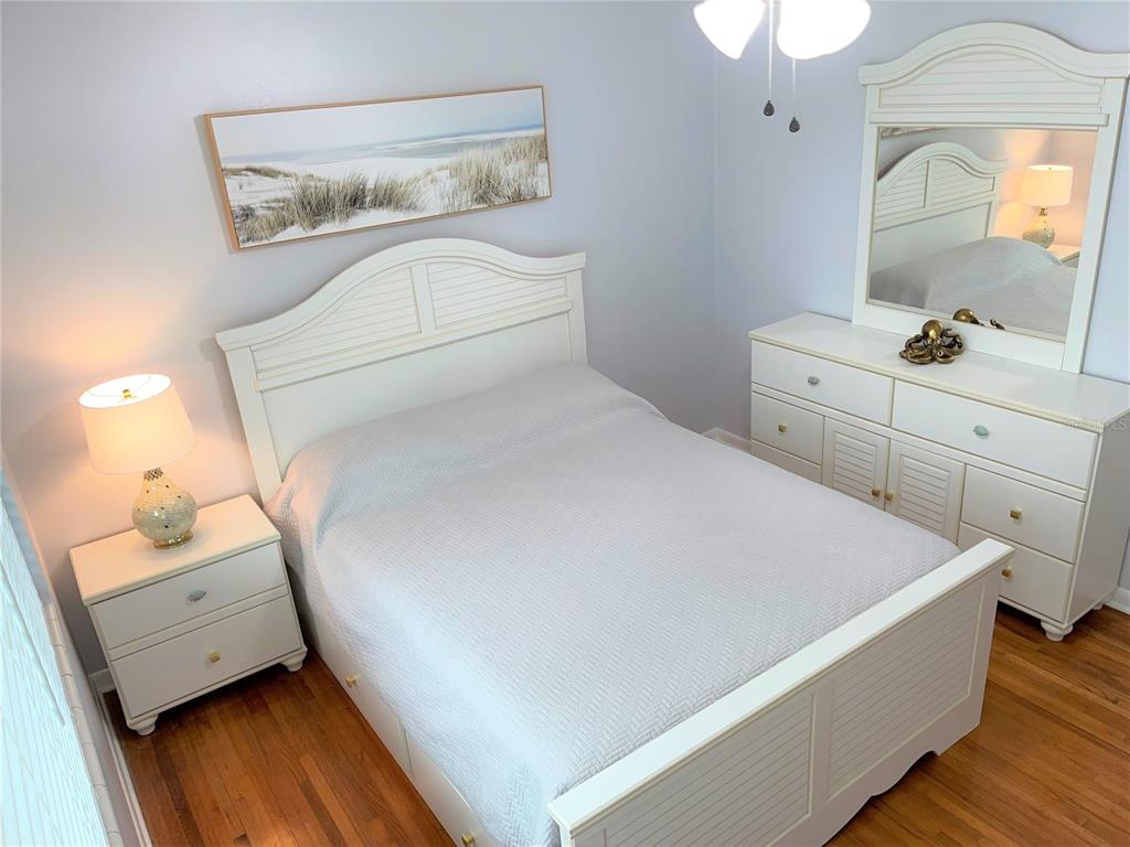1963 Ripon Drive Clearwater, FL 33764 - Photo 15 of 29 a bed room with a bed and a mirror