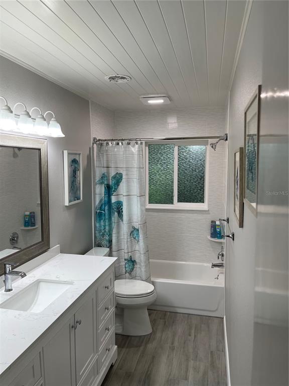 1963 Ripon Drive Clearwater, FL 33764 - Photo 16 of 29 a bathroom with a granite countertop sink toilet and shower