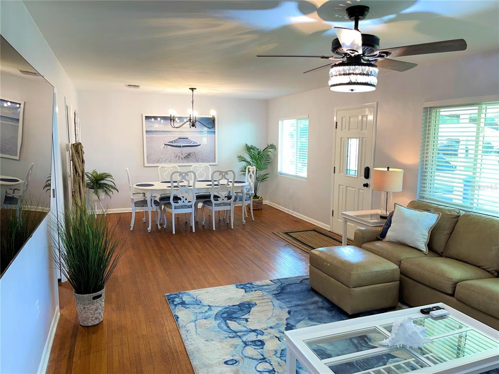 1963 Ripon Drive Clearwater, FL 33764 - Photo 2 of 29 a living room with furniture and a chandelier