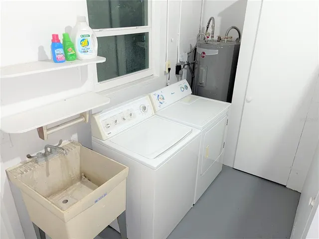 a utility room with dryer and washer