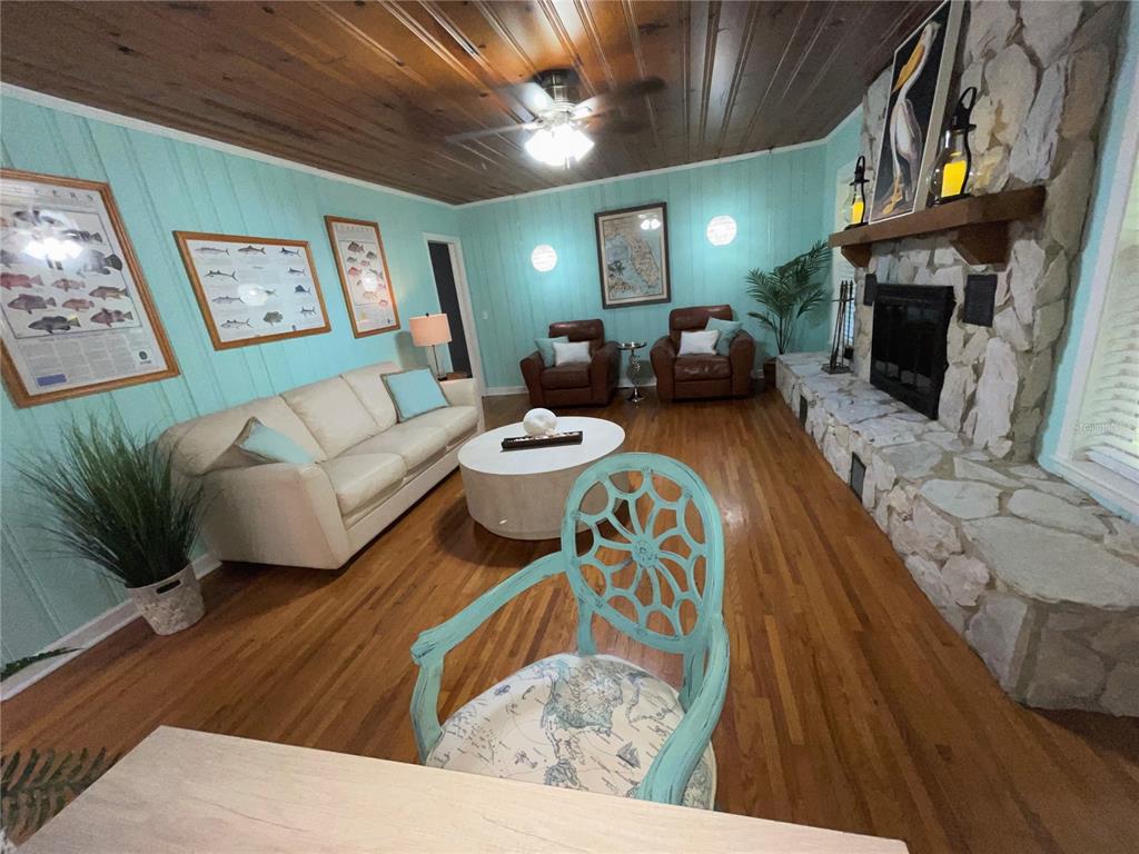 1963 Ripon Drive Clearwater, FL 33764 - Photo 9 of 29 a living room with furniture and a fireplace