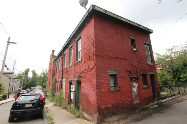 a view of a car parked in front of a house