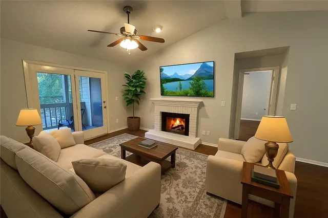 a living room with furniture and a fireplace