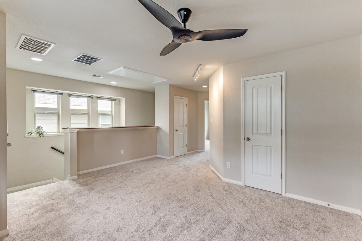 4607 Truth Way, Unit 440 Austin, TX 78725 - Photo 13 of 30 a view of an empty room and window
