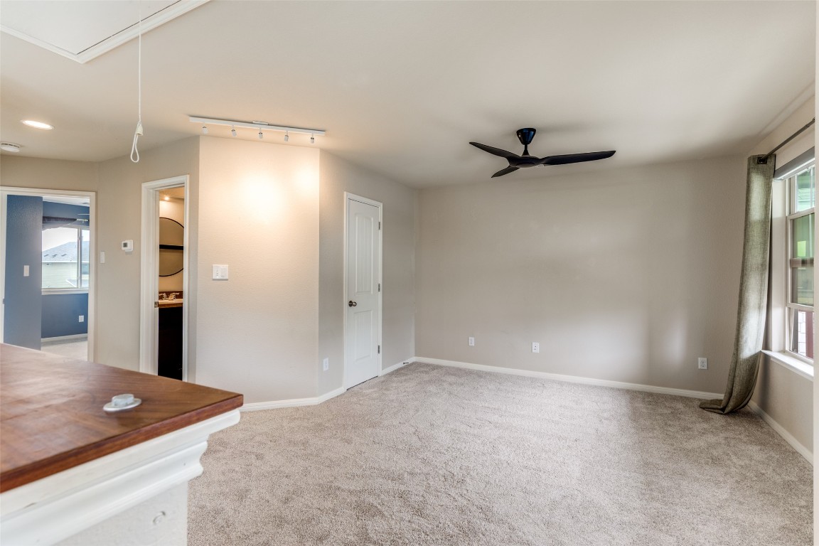 4607 Truth Way, Unit 440 Austin, TX 78725 - Photo 16 of 30 a view of a livingroom with a ceiling fan