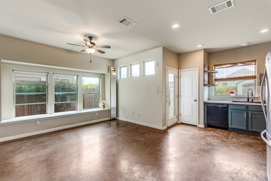 4607 Truth Way, Unit 440 Austin, TX 78725 - Photo 7 of 30 a view of an empty room with window and wooden floor