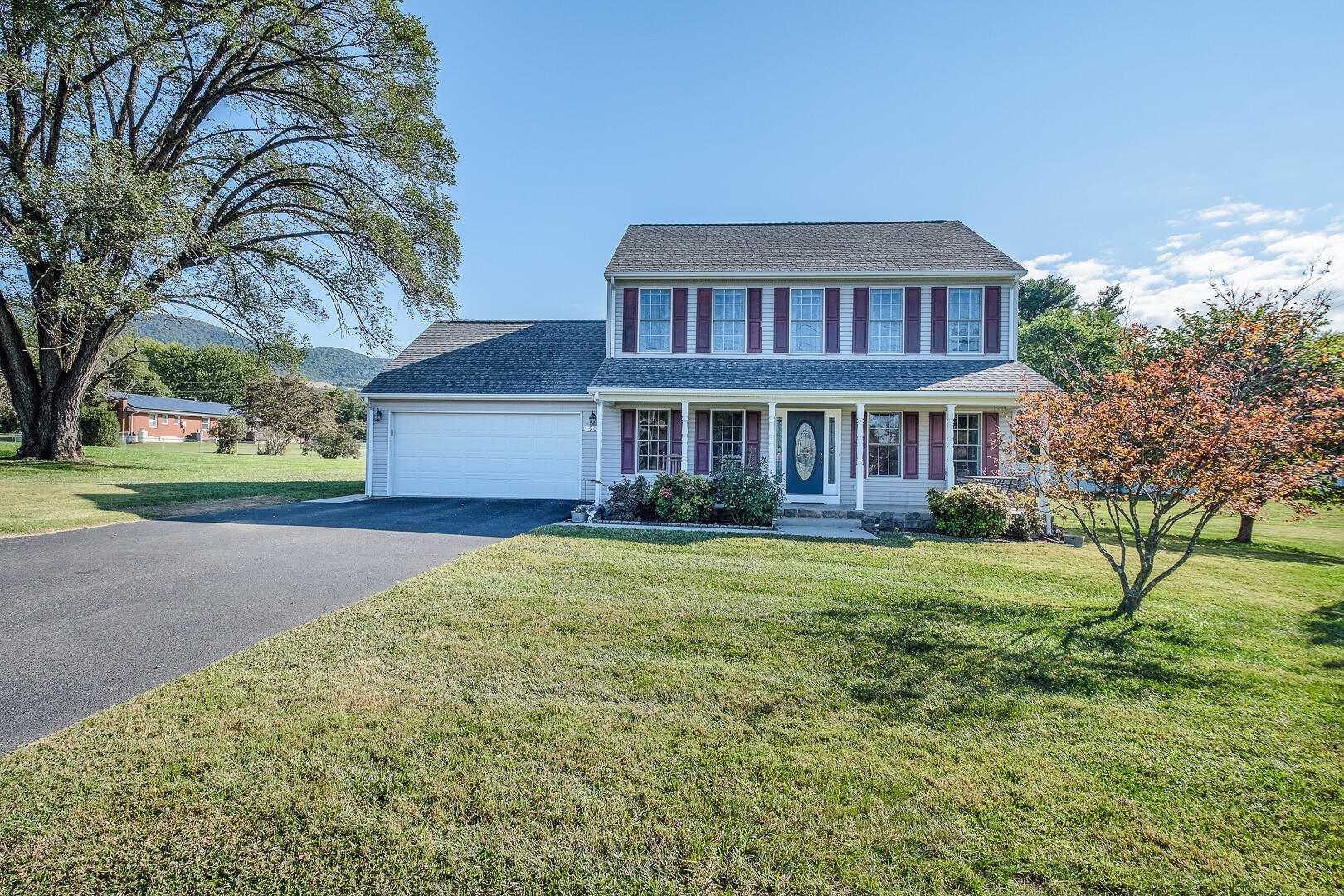 90 Oak Drive Blue Ridge, VA 24064 - Photo 1 of 38 a front view of a house with a yard