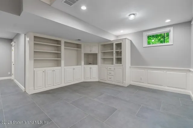 a bathroom with a sink a mirror and a shower