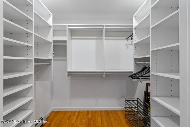 a bathroom with a sink a window and shower