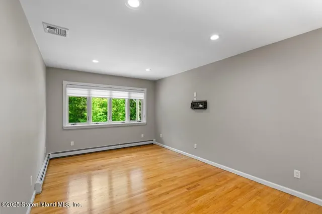 a kitchen with a refrigerator and a sink