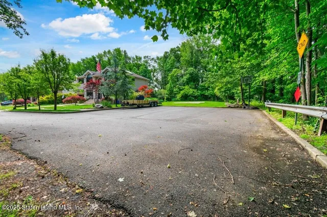 a view of entryway with wooden floor and stairs