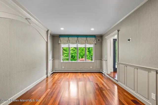 a large kitchen with stainless steel appliances granite countertop a stove a sink and a refrigerator