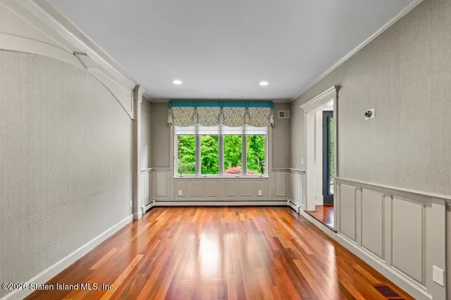 a large kitchen with stainless steel appliances granite countertop a stove a sink and a refrigerator