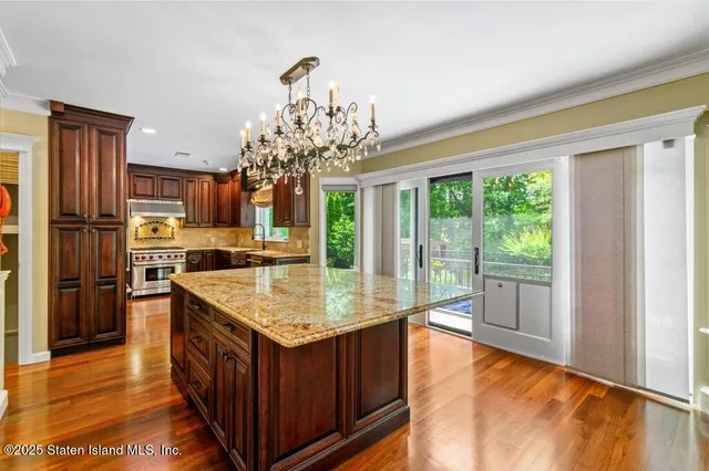 a room with pool table and windows
