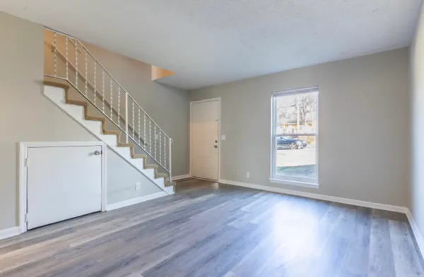 a view of room with window and hardwood floor