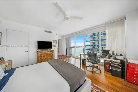 a bed room with furniture and a window