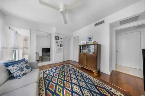 a living room with furniture fireplace and a window