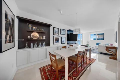 a living room with stainless steel appliances kitchen island granite countertop furniture and a livingroom