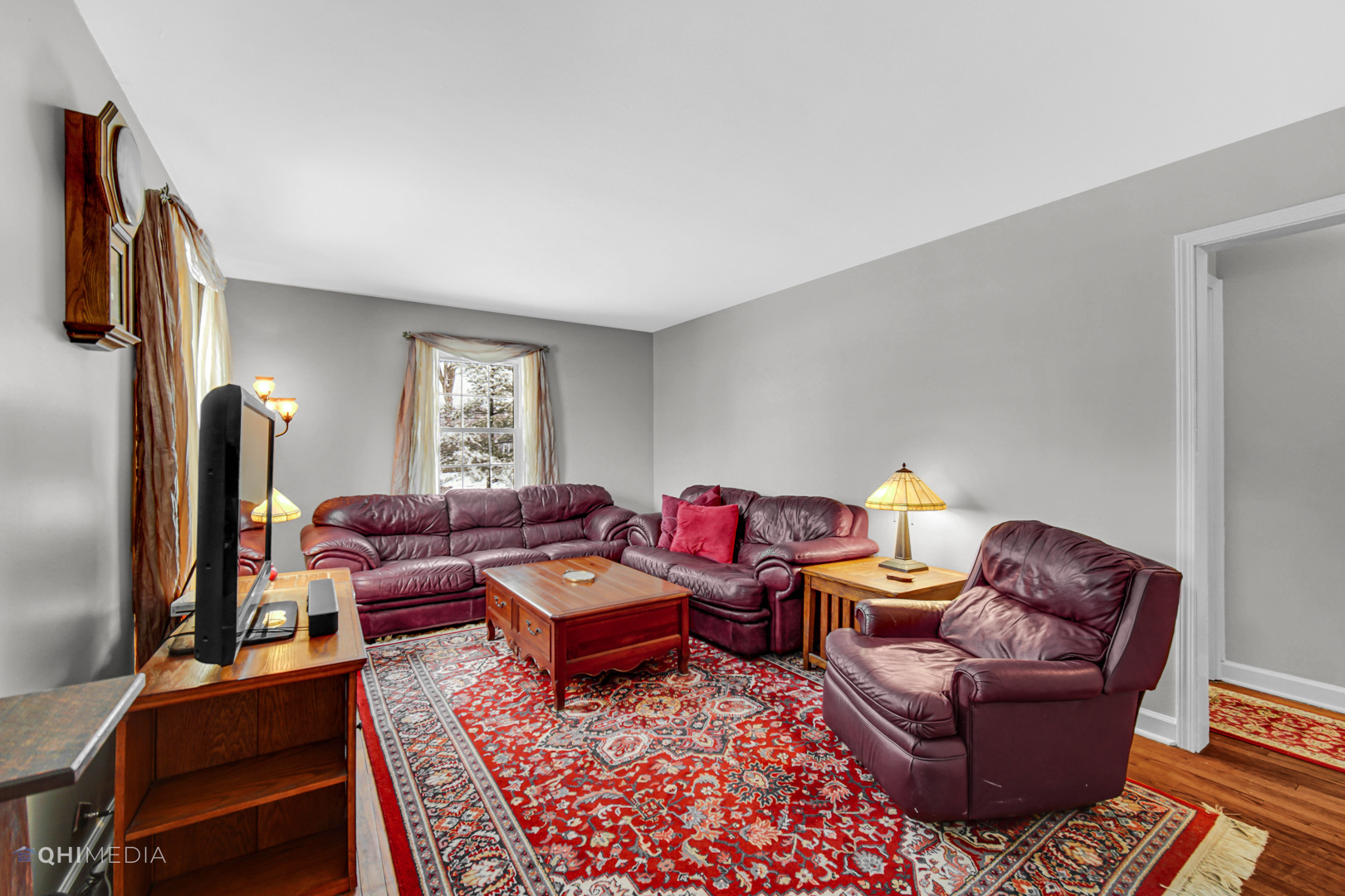 1118 Manchester Road Wheaton, IL 60187 - Photo 12 of 19 a living room with furniture a rug and a window