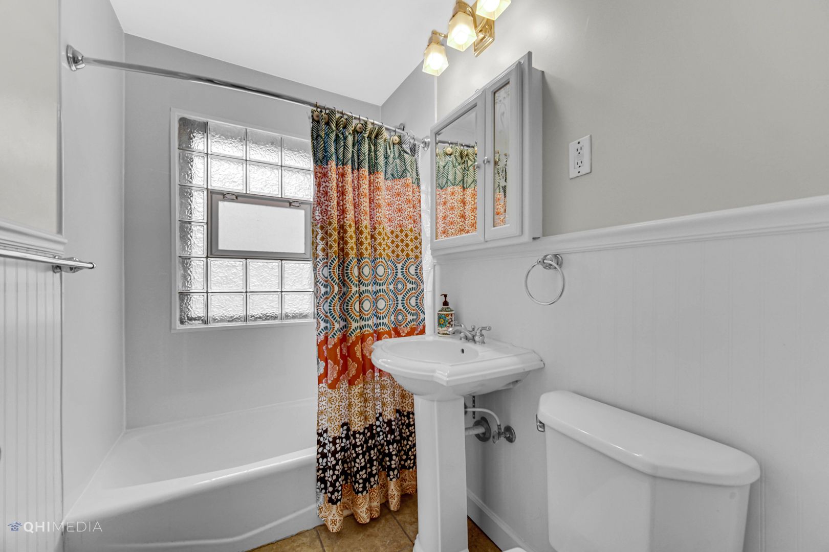 1118 Manchester Road Wheaton, IL 60187 - Photo 18 of 19 a bathroom with a sink toilet and shower