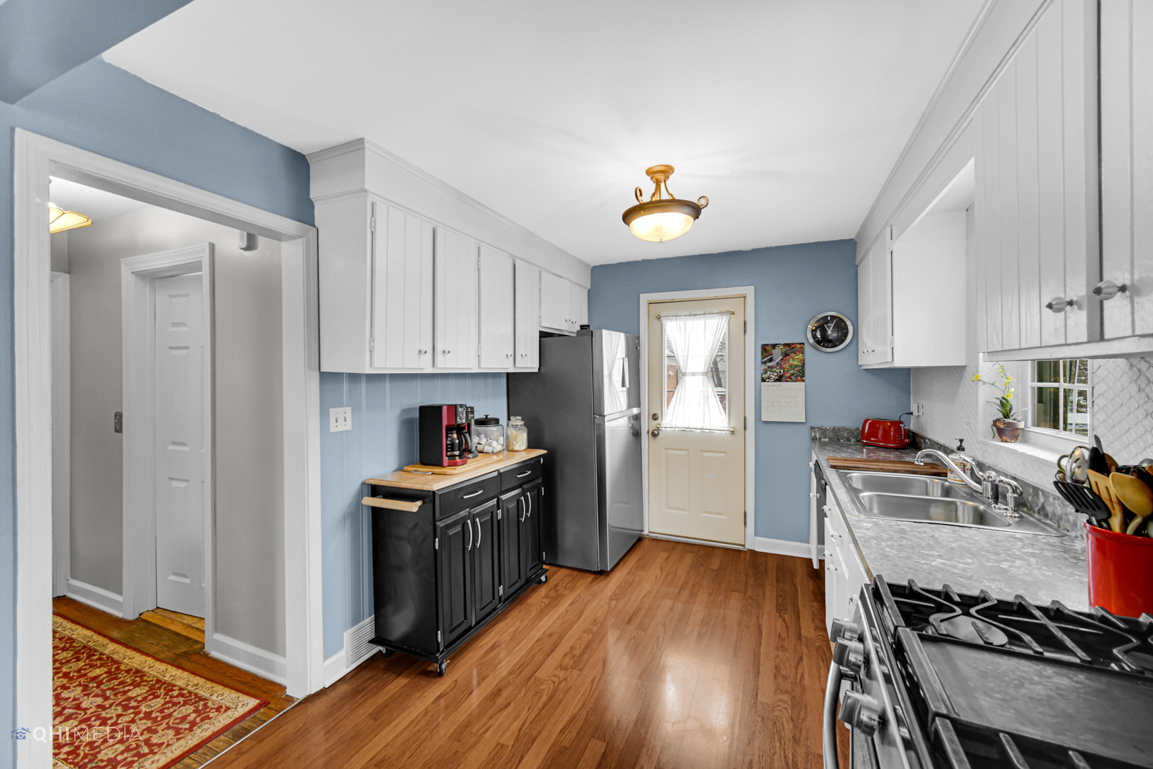 1118 Manchester Road Wheaton, IL 60187 - Photo 2 of 19 a kitchen with stainless steel appliances granite countertop a stove and a refrigerator