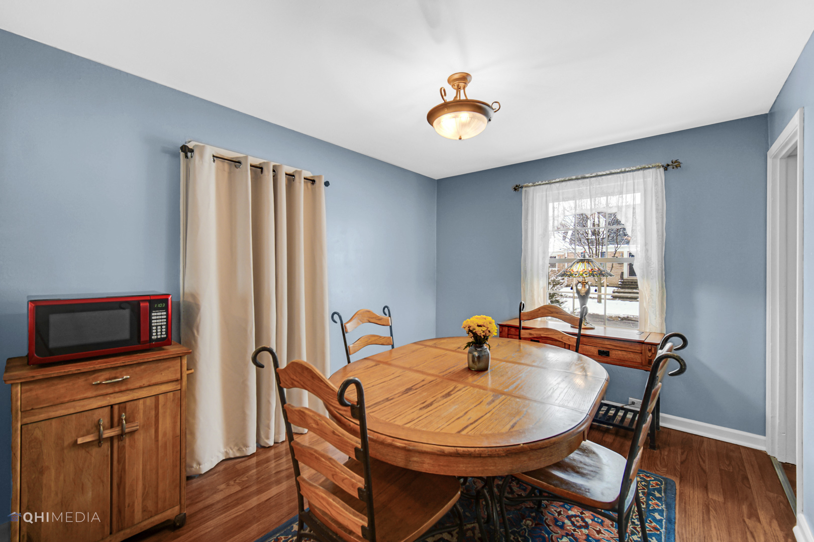 1118 Manchester Road Wheaton, IL 60187 - Photo 3 of 19 a view of a dining room with furniture window and wooden floor