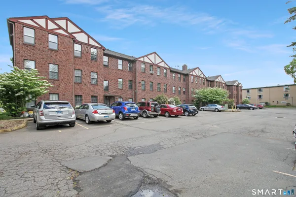 a view of a building with a yard