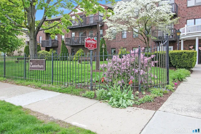 a living room with furniture a table and chairs