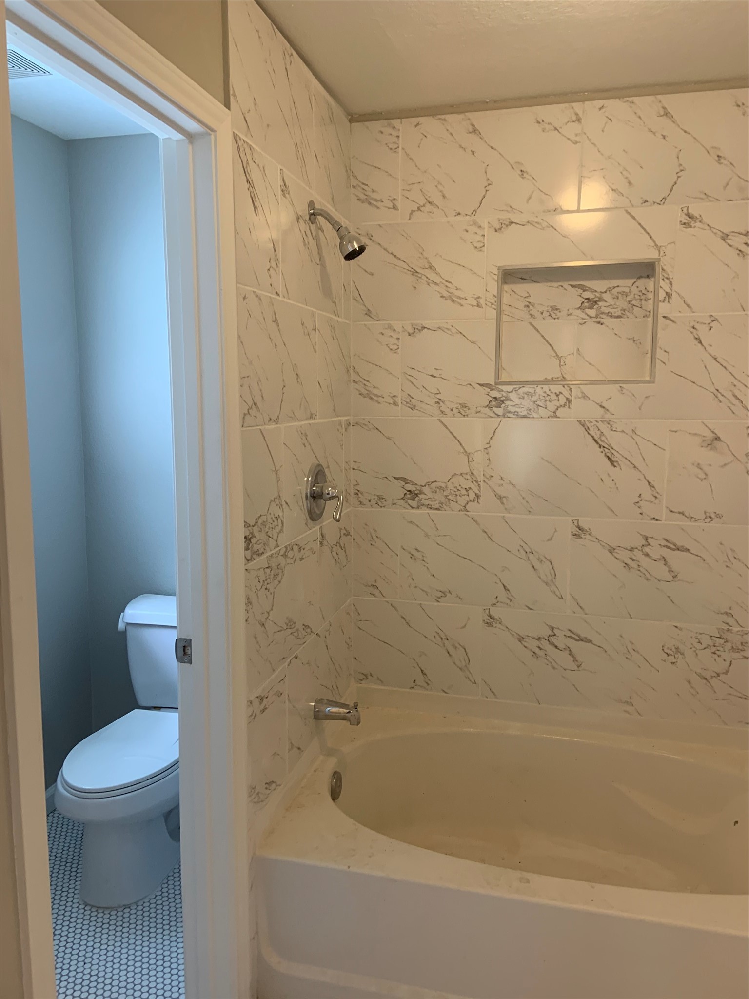 10978 Youpon Street Cleveland, TX 77328 - Photo 18 of 24 a bathroom with a shower and a toilet