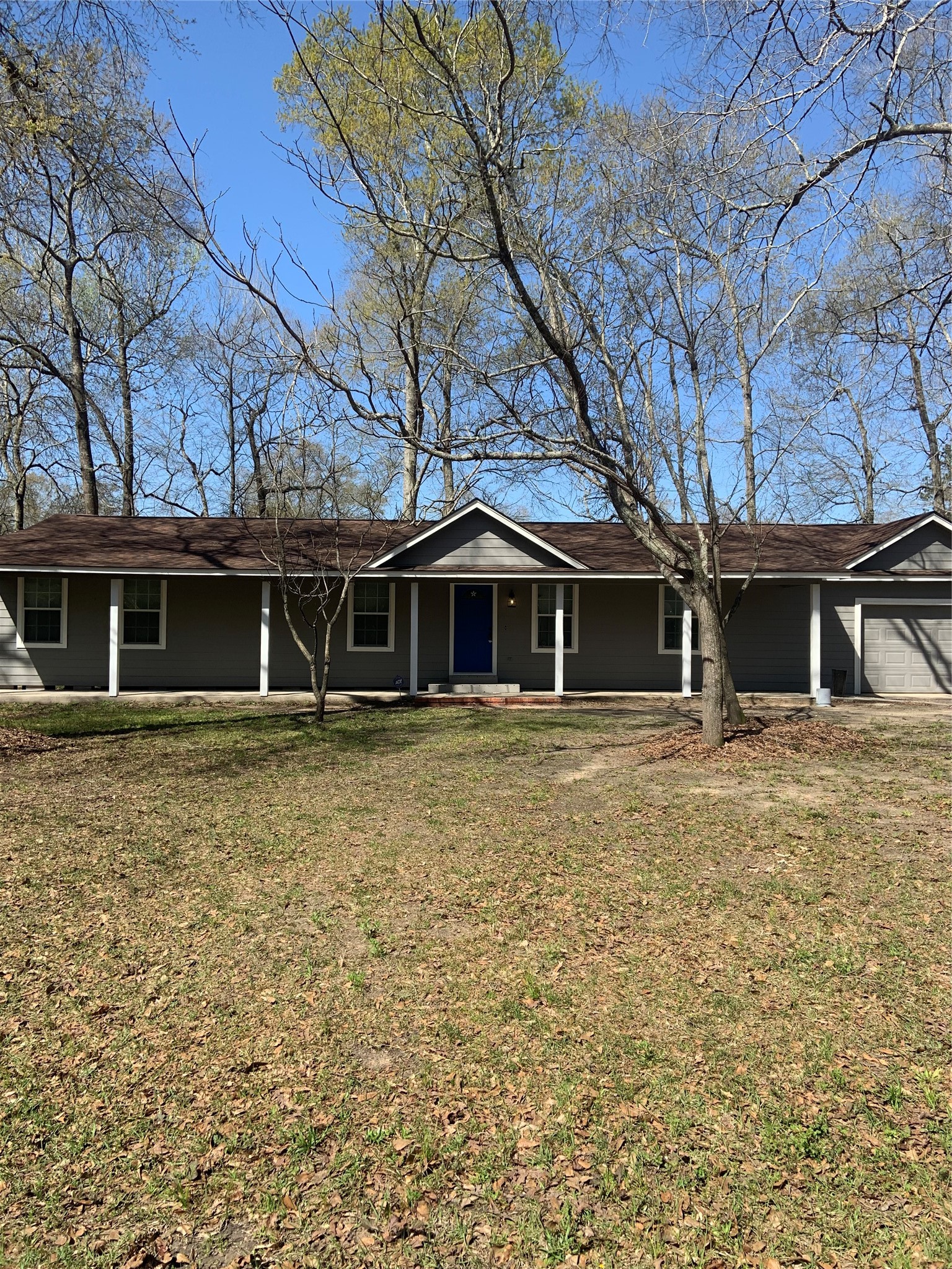 10978 Youpon Street Cleveland, TX 77328 - Photo 2 of 24 a front view of a house with a garden