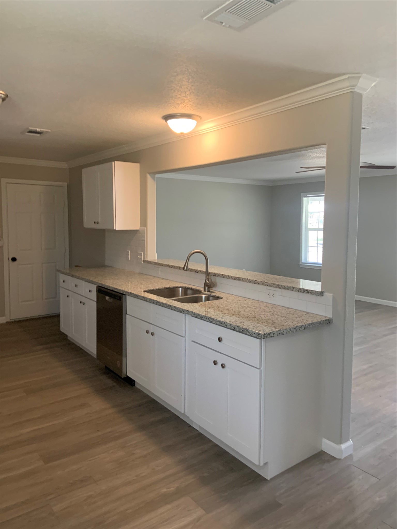 10978 Youpon Street Cleveland, TX 77328 - Photo 7 of 24 a spacious bathroom with a granite countertop sink and a mirror