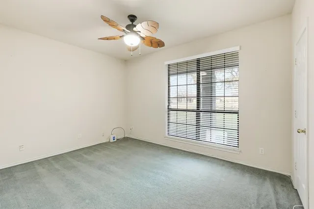 a bathroom with a sink a toilet a mirror and shower