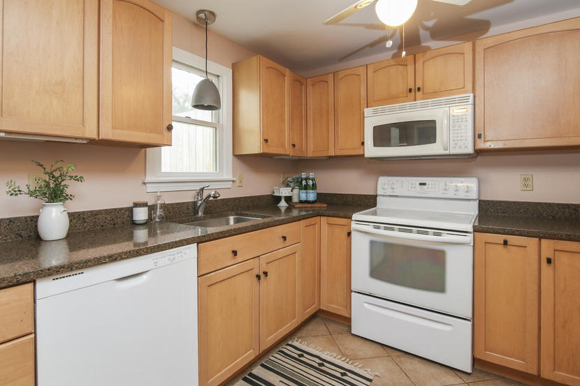 18 Sandy Valley Road Marstons Mills, MA 02648 - Photo 12 of 25 a kitchen with stainless steel appliances granite countertop white cabinets a sink and dishwasher