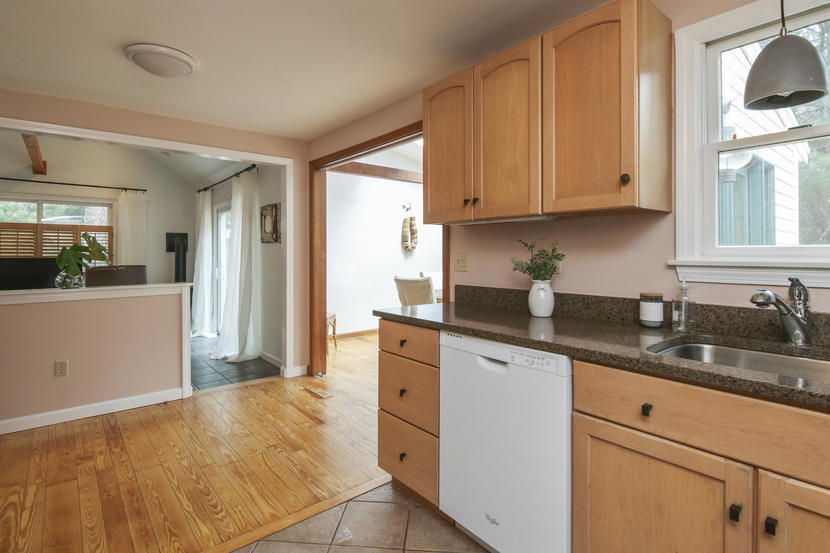 18 Sandy Valley Road Marstons Mills, MA 02648 - Photo 13 of 25 a kitchen with granite countertop a sink a stove and cabinets
