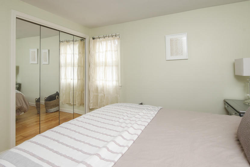 18 Sandy Valley Road Marstons Mills, MA 02648 - Photo 16 of 25 a bedroom with a bed and a large mirror