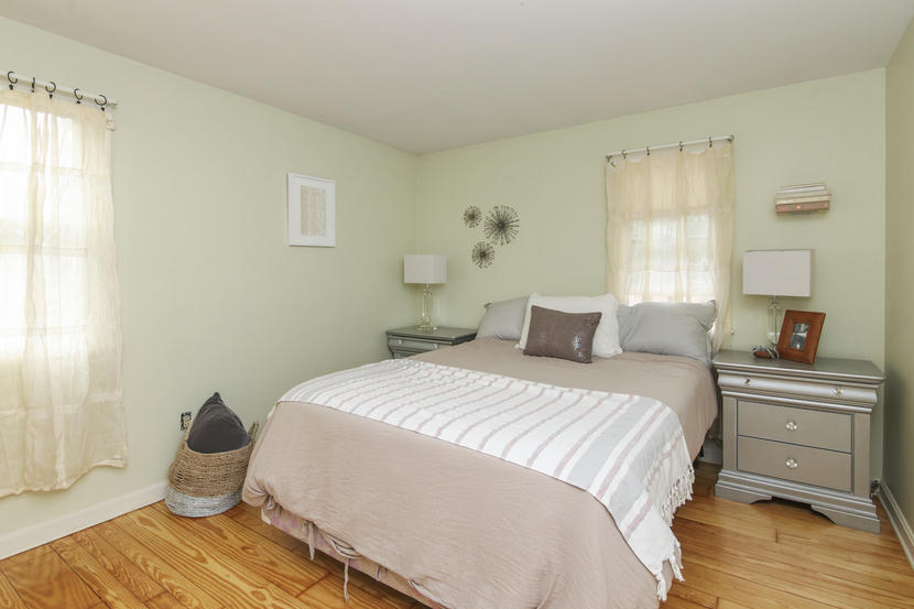 18 Sandy Valley Road Marstons Mills, MA 02648 - Photo 17 of 25 a bedroom with a bed and wooden floor
