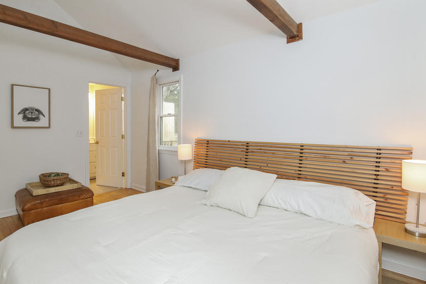 18 Sandy Valley Road Marstons Mills, MA 02648 - Photo 19 of 25 a bedroom with a bed and a lamp