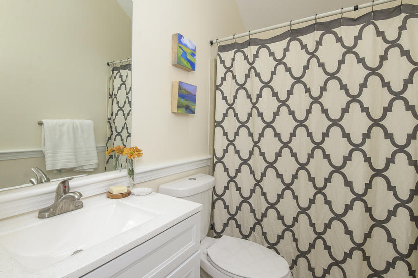 18 Sandy Valley Road Marstons Mills, MA 02648 - Photo 21 of 25 a bathroom with a sink a toilet and shower curtain